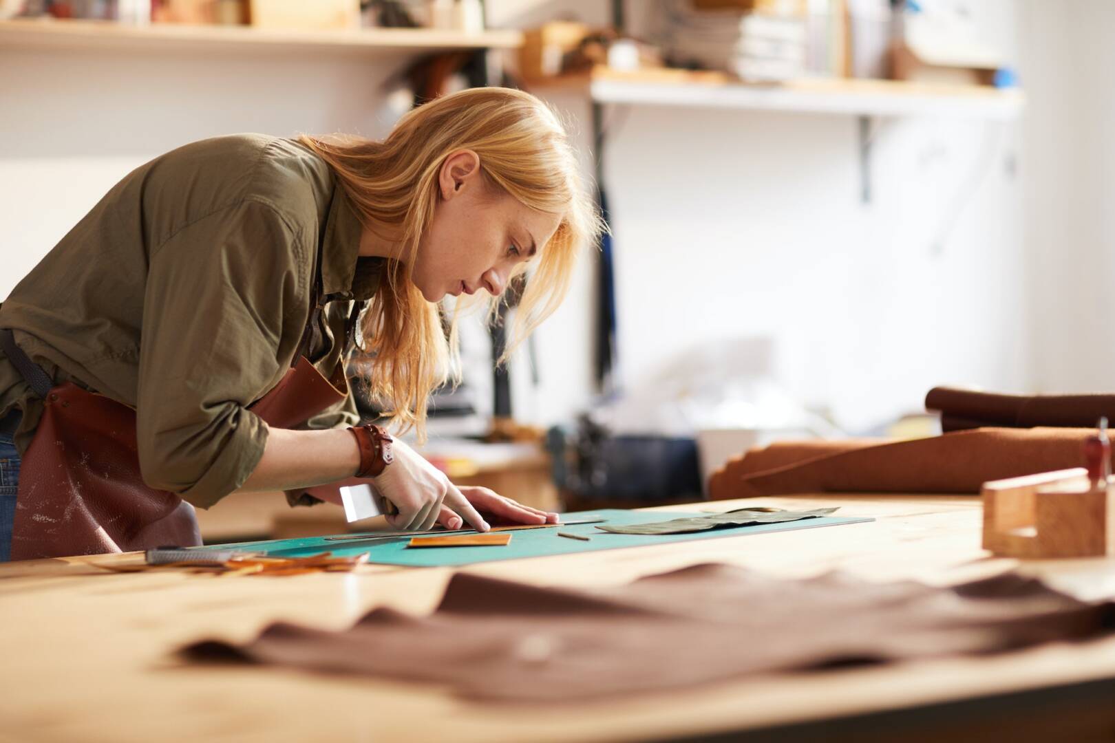 Female Tailor Working with Leather